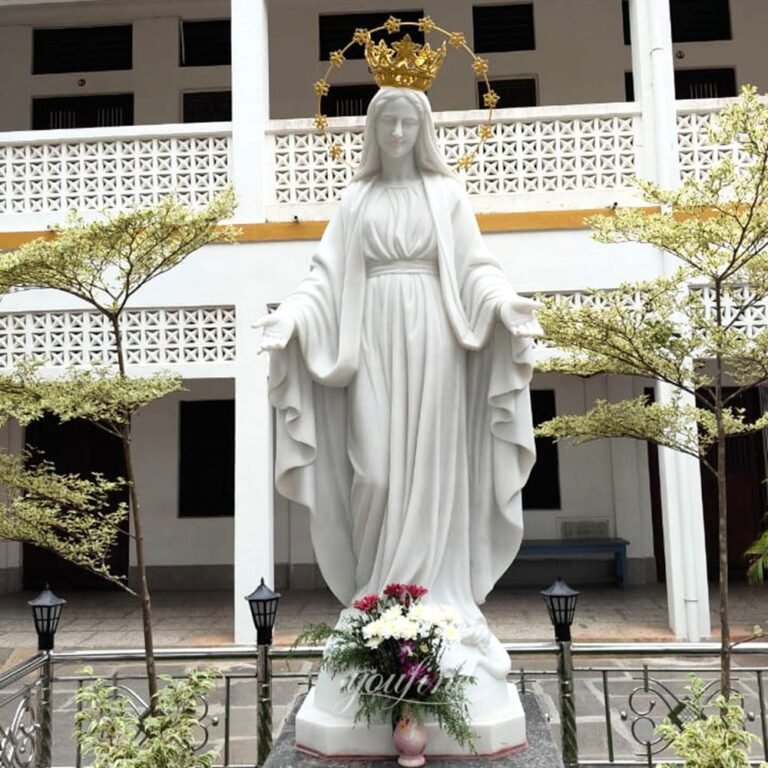 A sculpture of the Virgin Mary in a community
