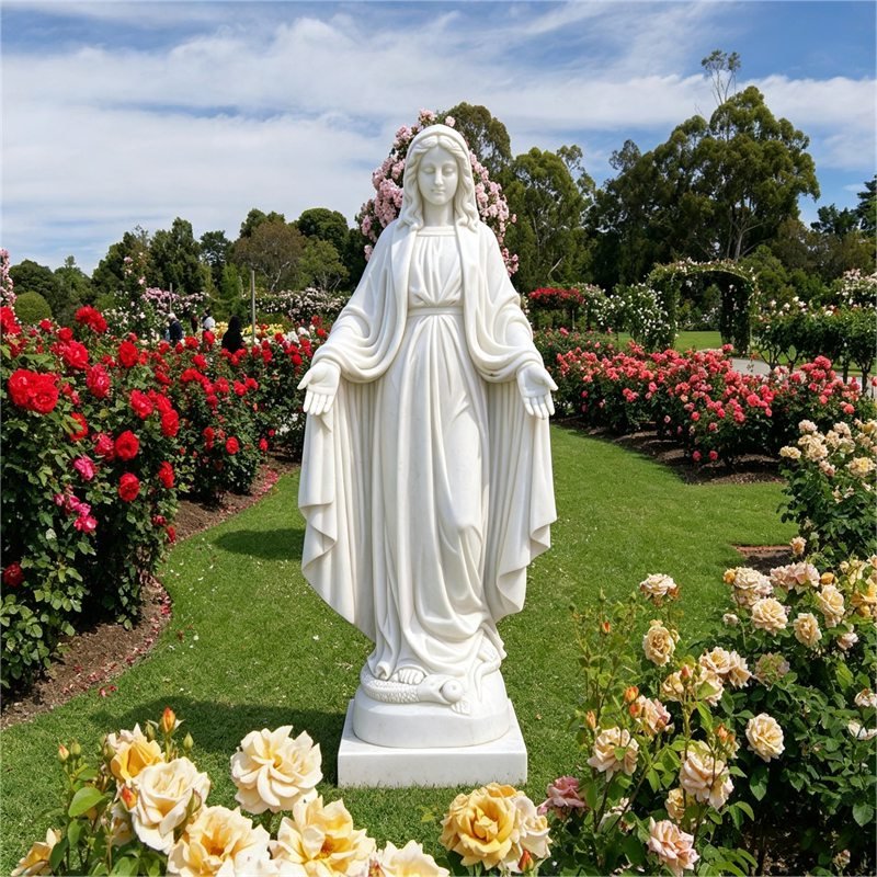 White marble statue of the Virgin Mary standing on a snake, surrounded by blooming roses in a garden. Customer feedback photo from Castle.