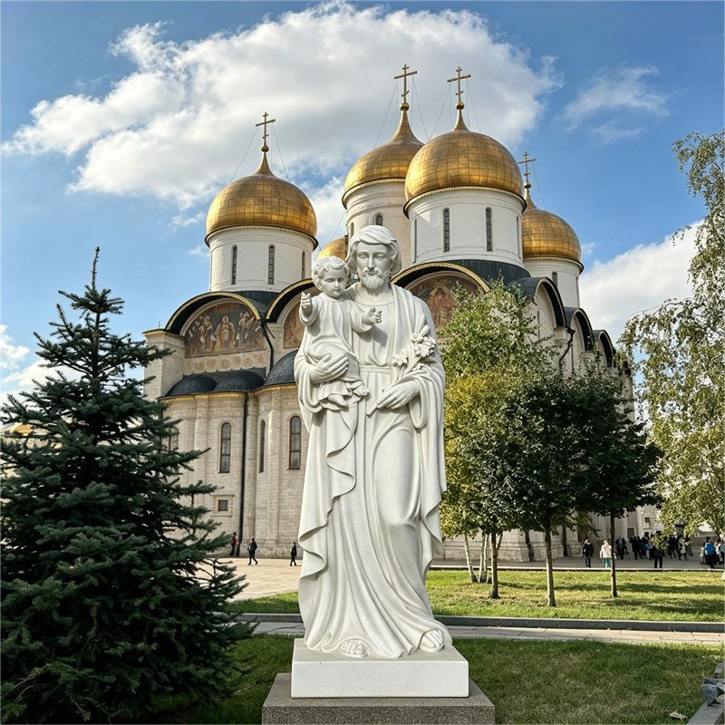 Hand-carved marble Saint Joseph with Child statue, ideal for church and religious outdoor decor.