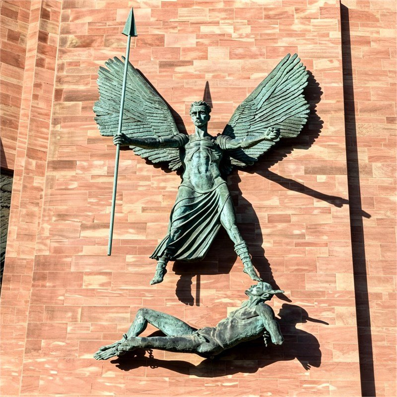 St Michael’s Victory over the Devil on the south end of the east wall outside of the new Coventry Cathedral.