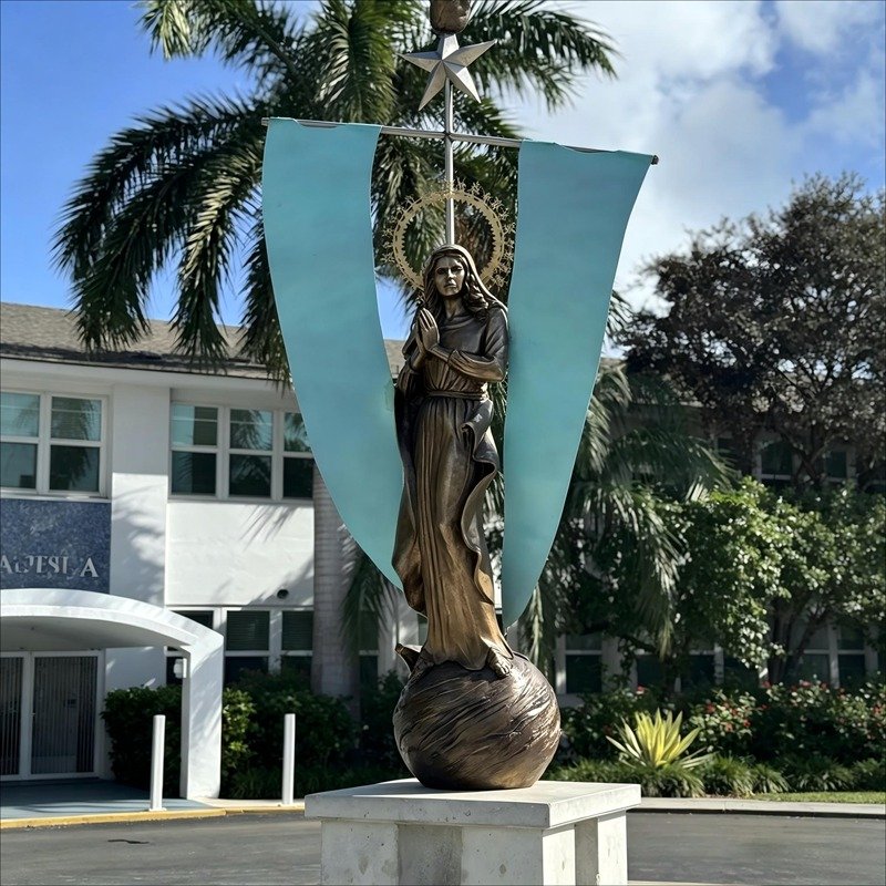 Stella Maris bronze statue, symbol of hope and guidance at Saint Mary Star of the Sea Basilica School, Key West, 2024. The statue of Saint Mary faces west with full copper sails, standing as a beacon of faith amid life’s storms.