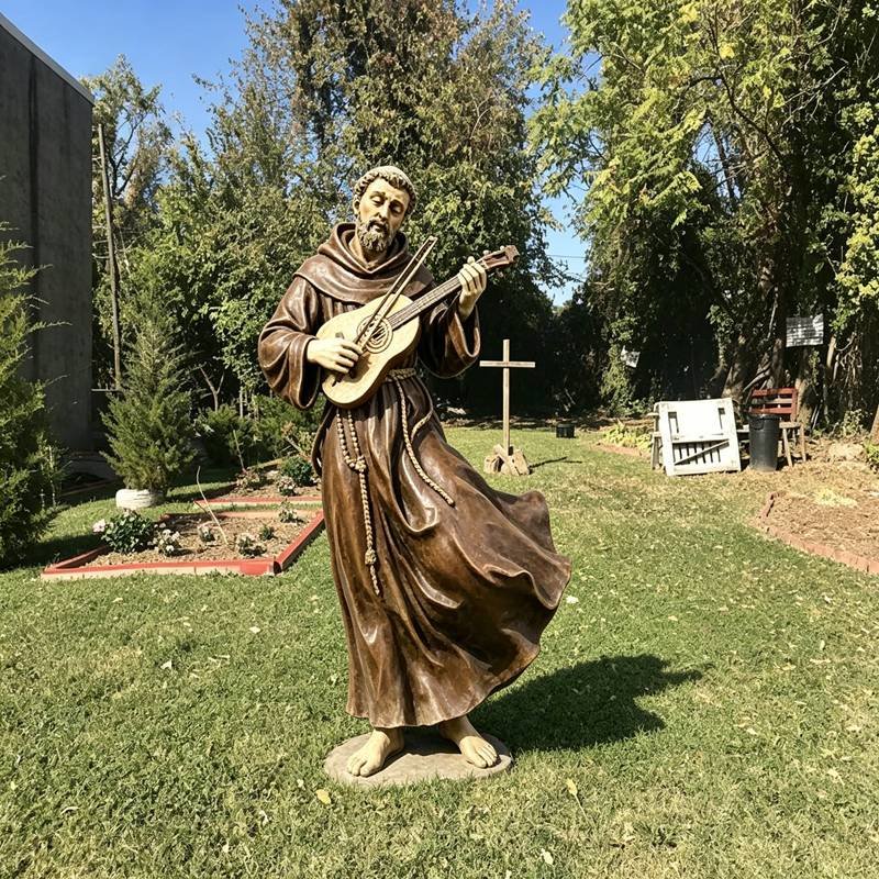 Saint Francis holding a rebec statue