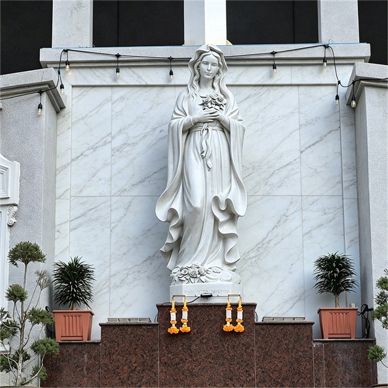 Mystic Rose Mary marble statue, white marble wall shrine, church indoor devotional sculpture