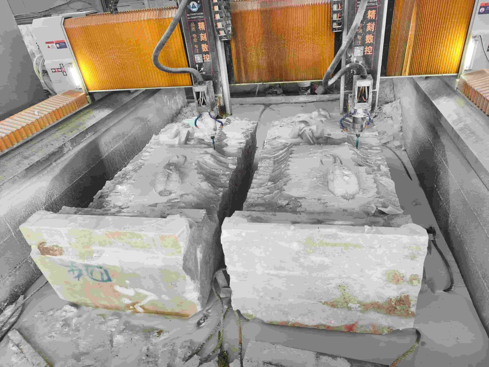 Large Saint Michael statue carving process and details 01 — CNC double-head milling roughs the angel from a solid marble block