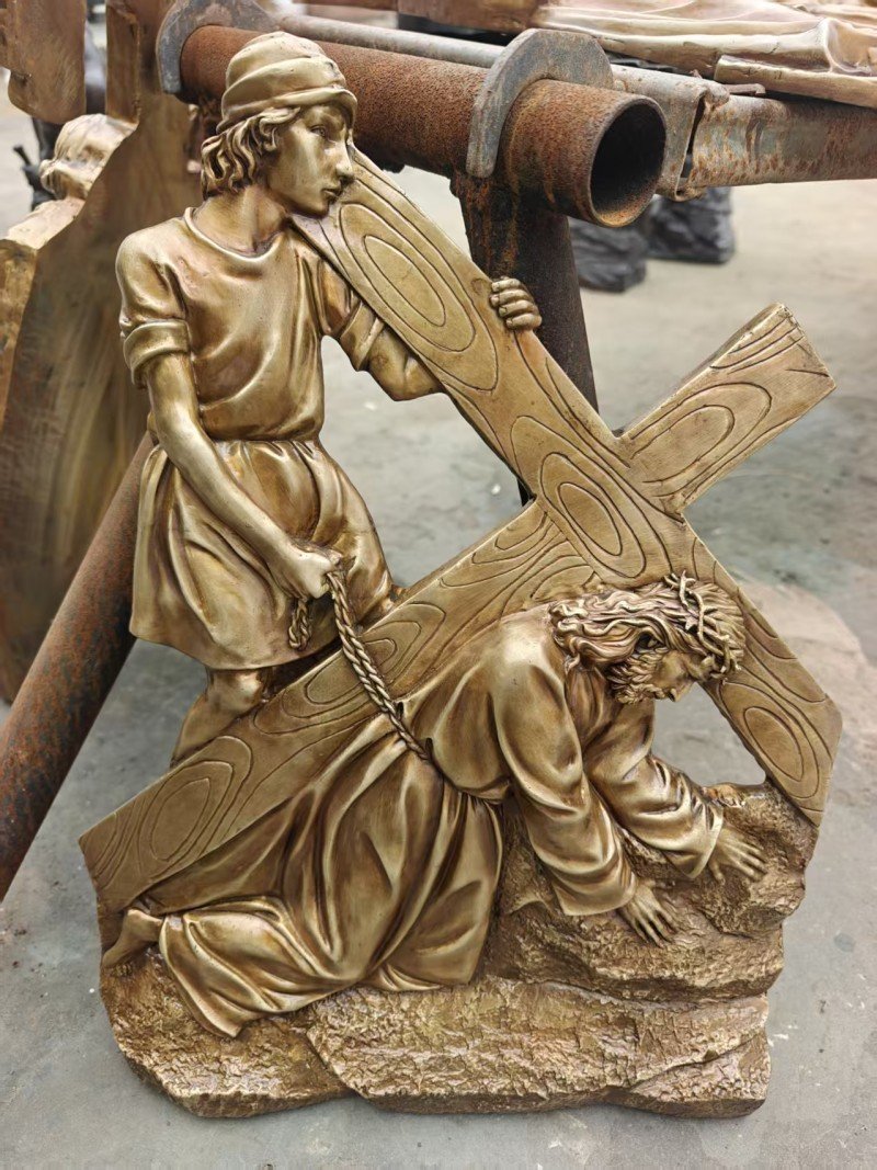 Gold-colored relief, Station III — Jesus falls the first time