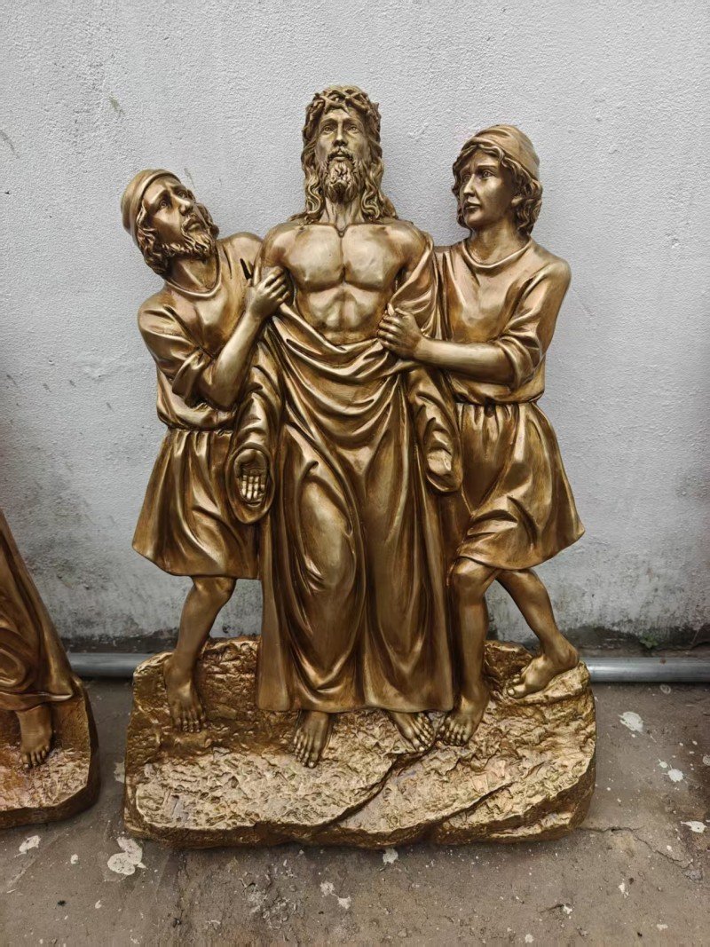Gold-colored relief, Station X — Jesus is stripped of his garments
