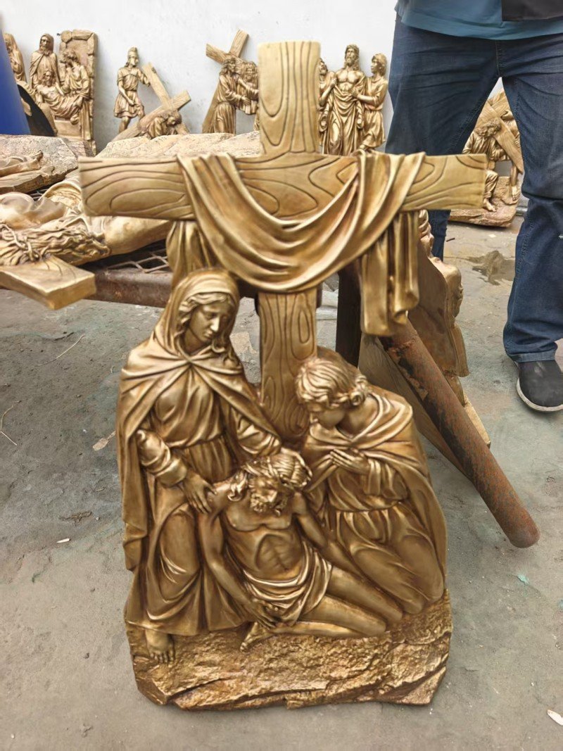 Gold-colored relief, Station XIII — Jesus is taken down from the cross